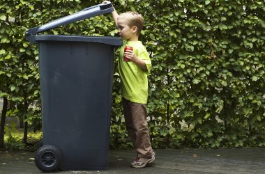 Boy Trashing A Can